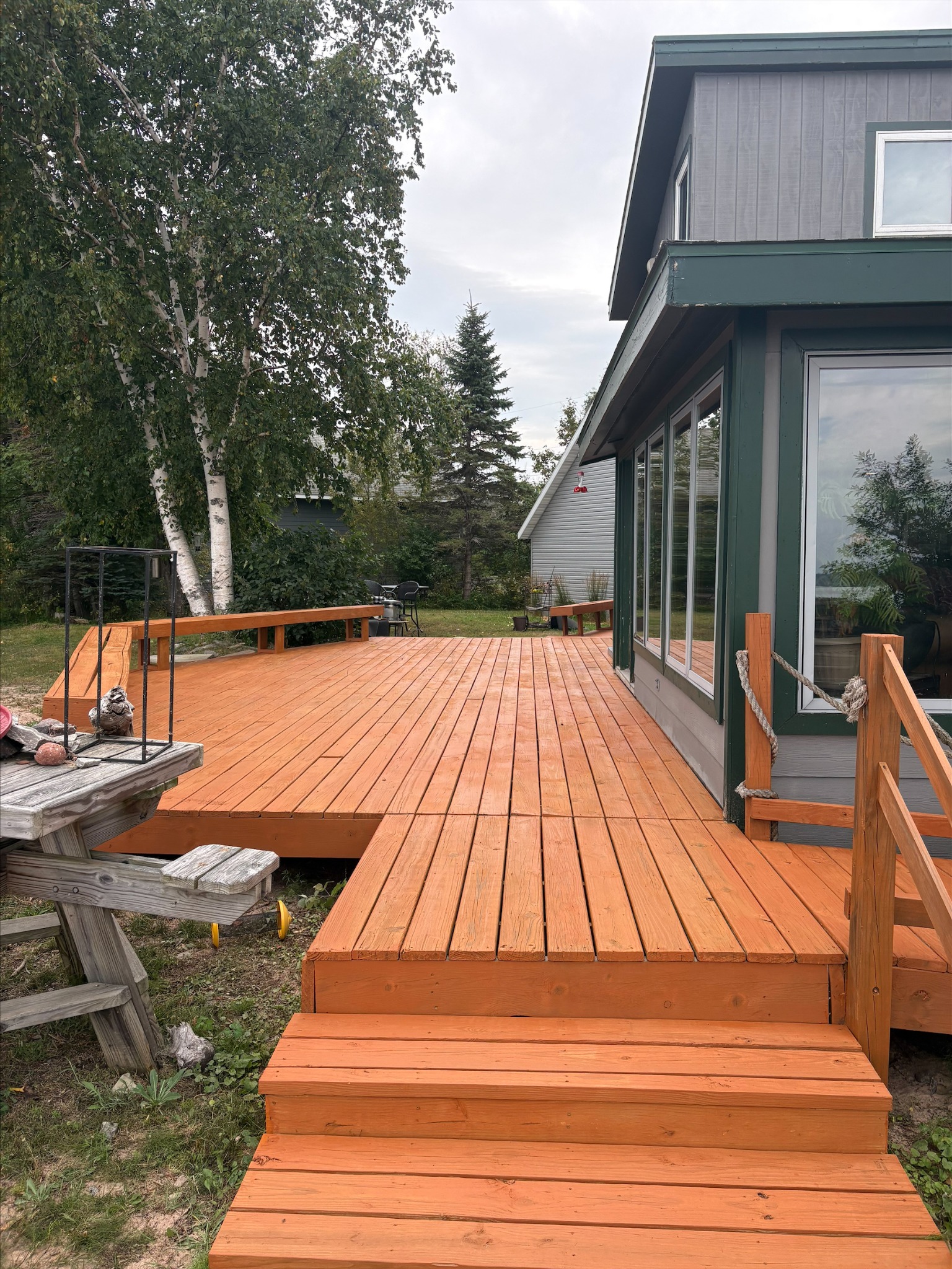 Wooden deck and steps beside a home